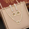 Collier et boucles d'oreilles de l'ensemble bijoux Arbre plaqué Or en zircon