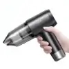 Aspirateur portable USAMS ZB291 tenu en main, compact et élégant avec un design noir moderne, idéal pour la maison et la voiture