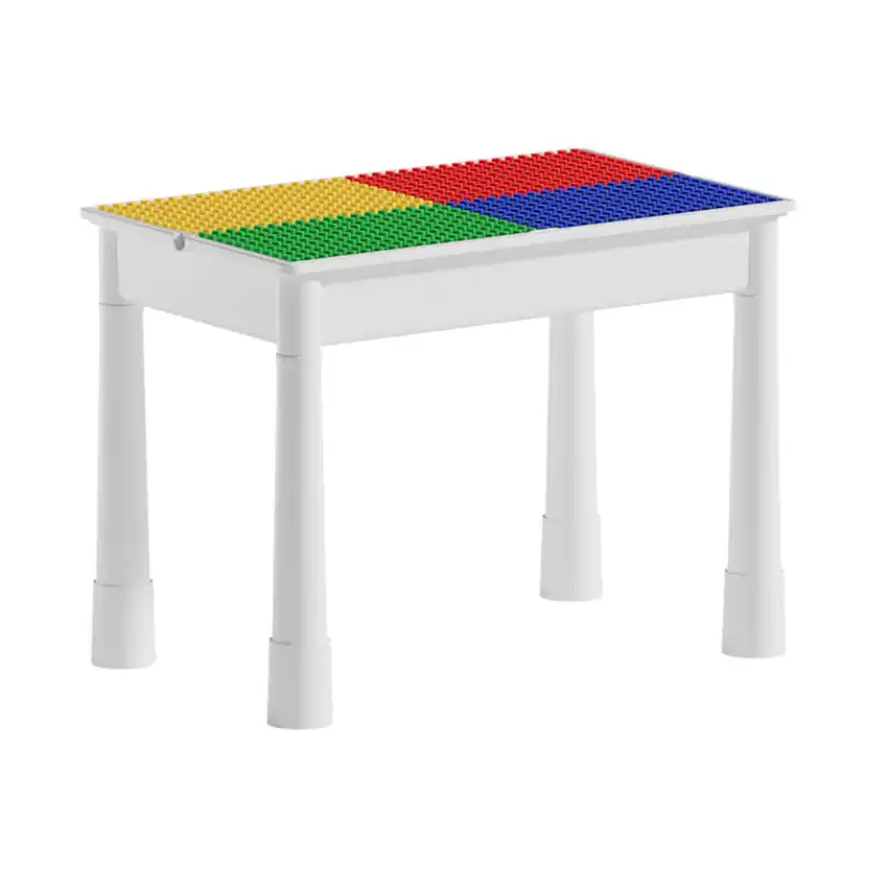 Table multifonctionnelle blanche avec plateau en blocs de construction colorés — idéale pour jouer, créer et apprendre en toute sécurité dès 3 ans.