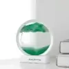 Lampe décorative sable mouvant 3D en version verte, posée sur bureau blanc — design élégant et moderne, parfaite comme objet de décoration zen ou cadeau original.