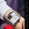 Homme portant la montre OLEVS 1101 au poignet, mettant en valeur le design rectangulaire robuste avec bracelet en cuir marron, style sport et élégant.