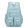 Sac à dos style coréen bleu ciel (menthe) grande capacité avec logo SHY GOODNESS, multiples poches avant à boucles blanches et bretelles rembourrées — mochila ergonomique et imperméable idéale pour le lycée, l'université et les voyages.